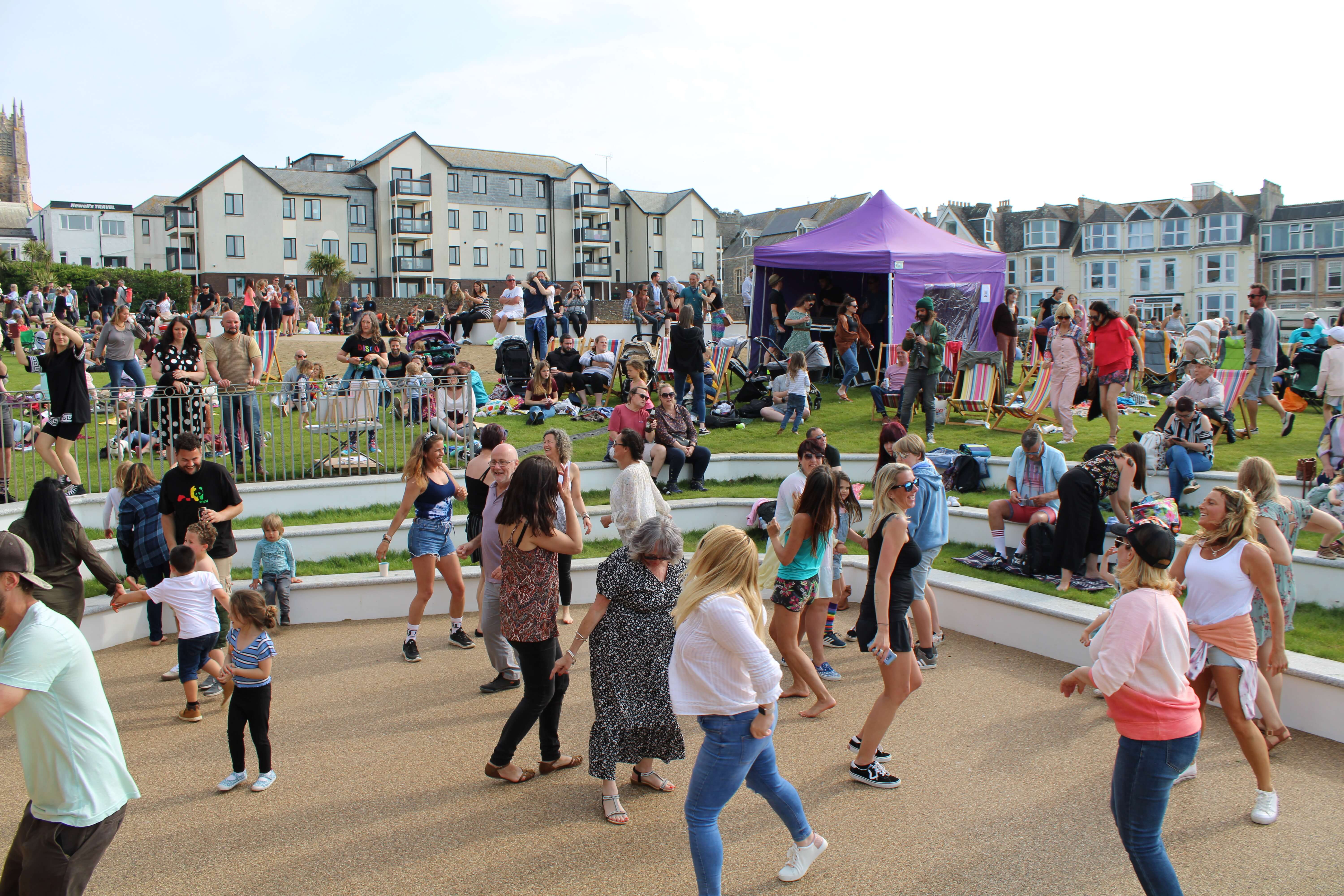 Crowds dance at an amphitheatre event on the Killacourt in Newquay