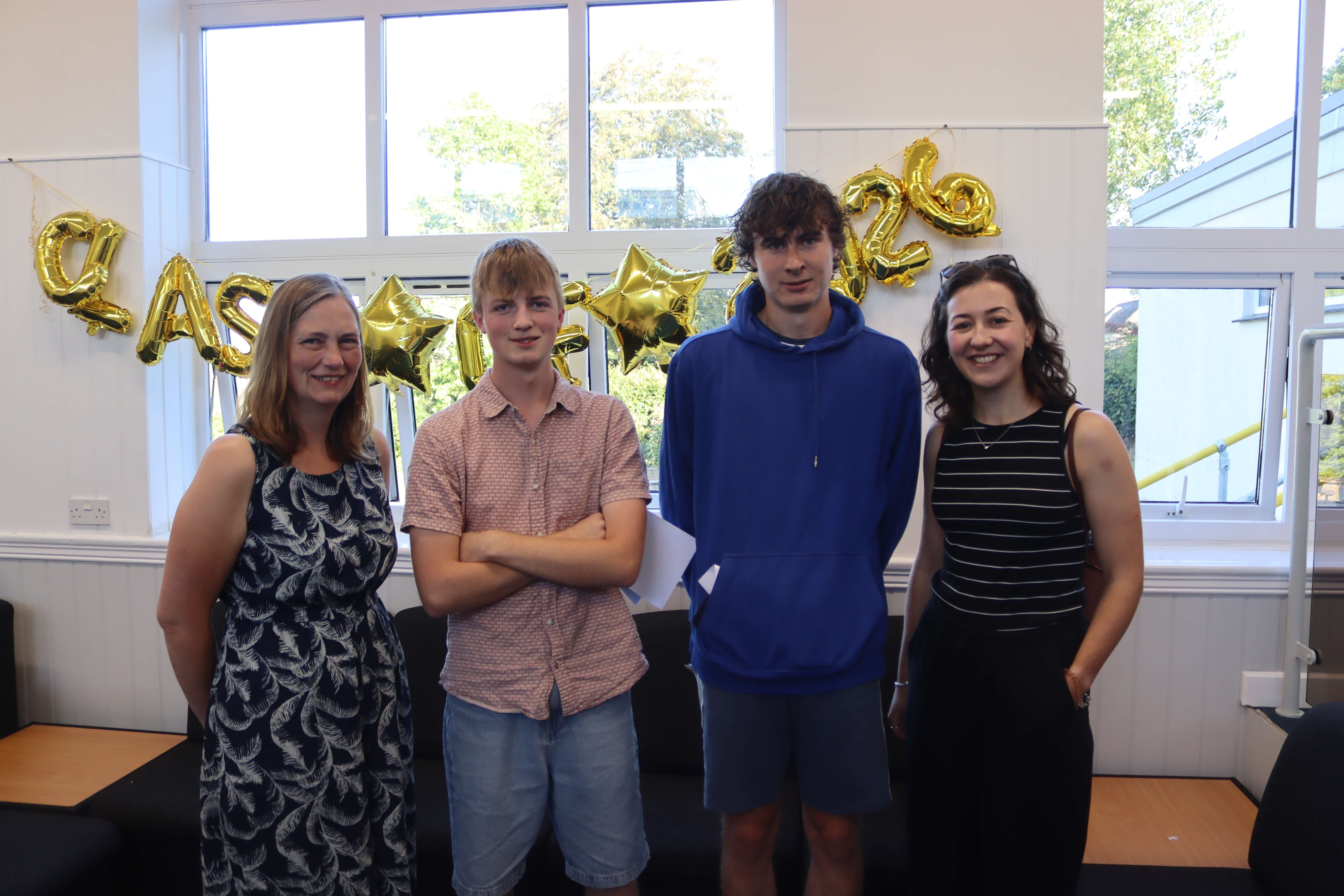 Launceston College A Level results day 2026, students and staff together beneath the Class of 2026 balloons