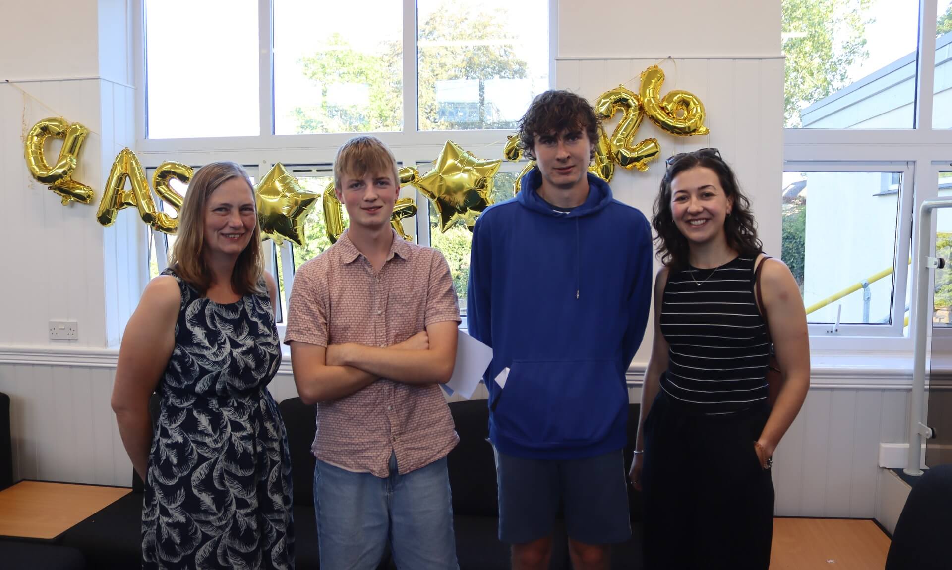Launceston College students and staff celebrating A Level results in 2026 under Class of 2026 balloons