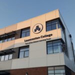 Launceston College building with its sign reading Part of the Athena Learning Trust