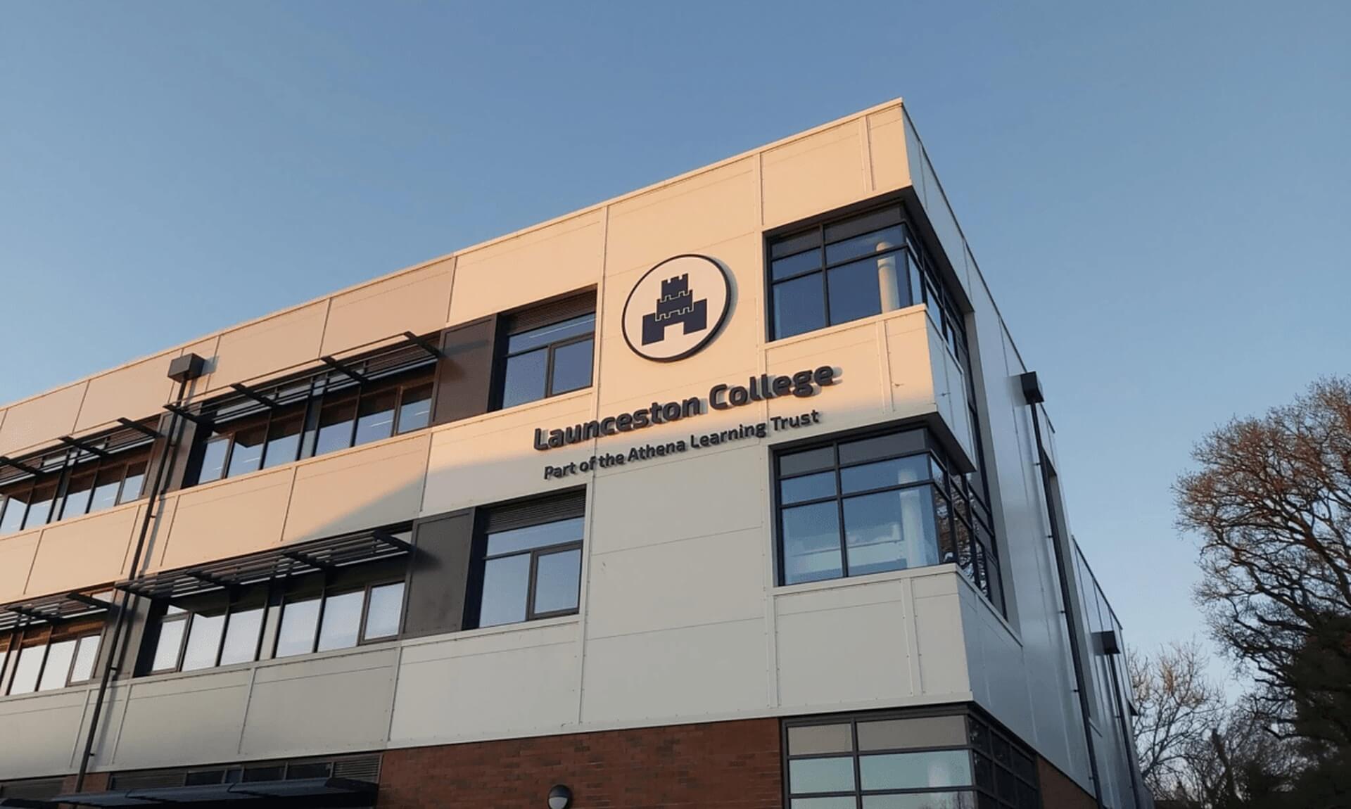Launceston College building with its sign reading Part of the Athena Learning Trust