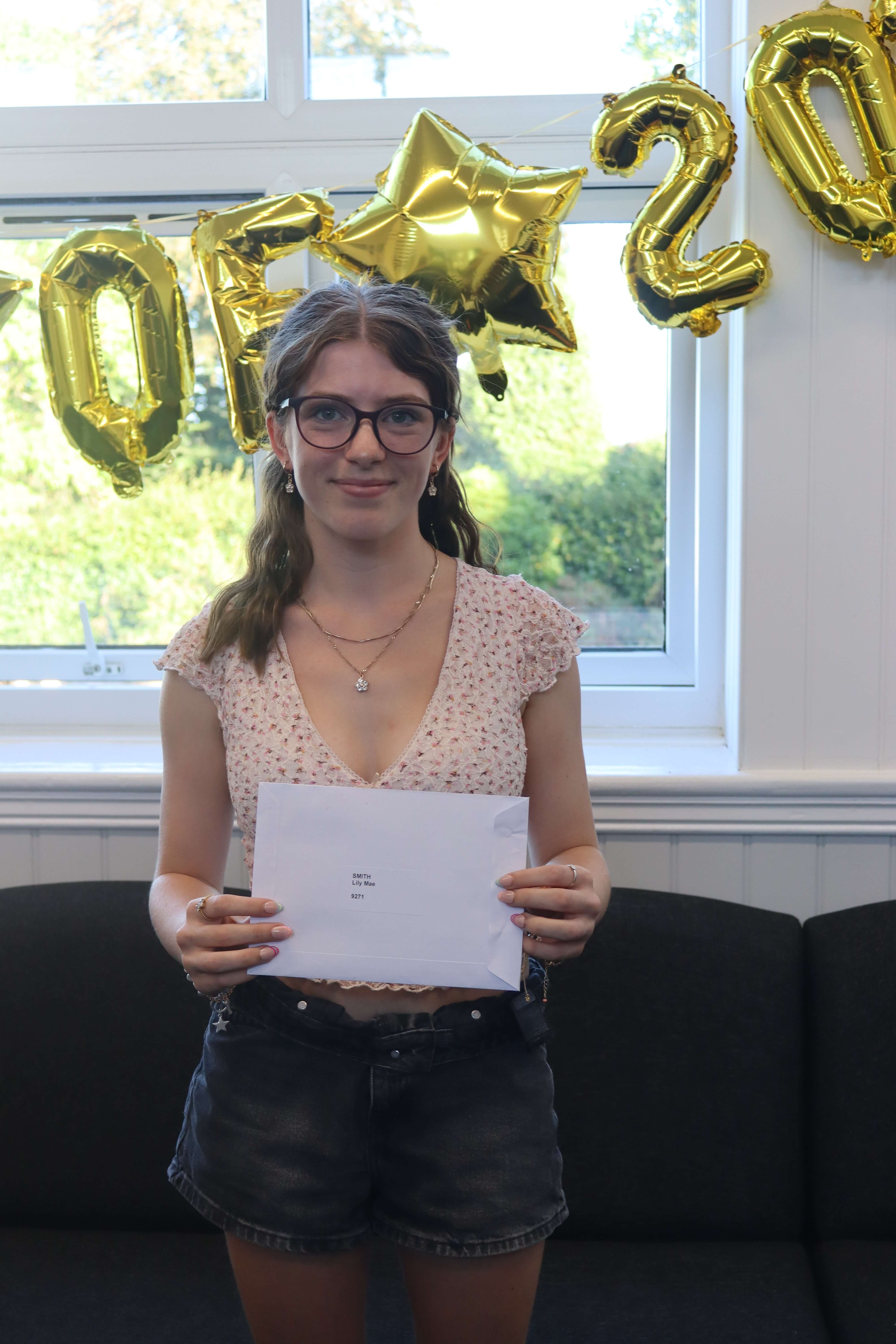 A Launceston College student holding her A Level results envelope on results day 2026