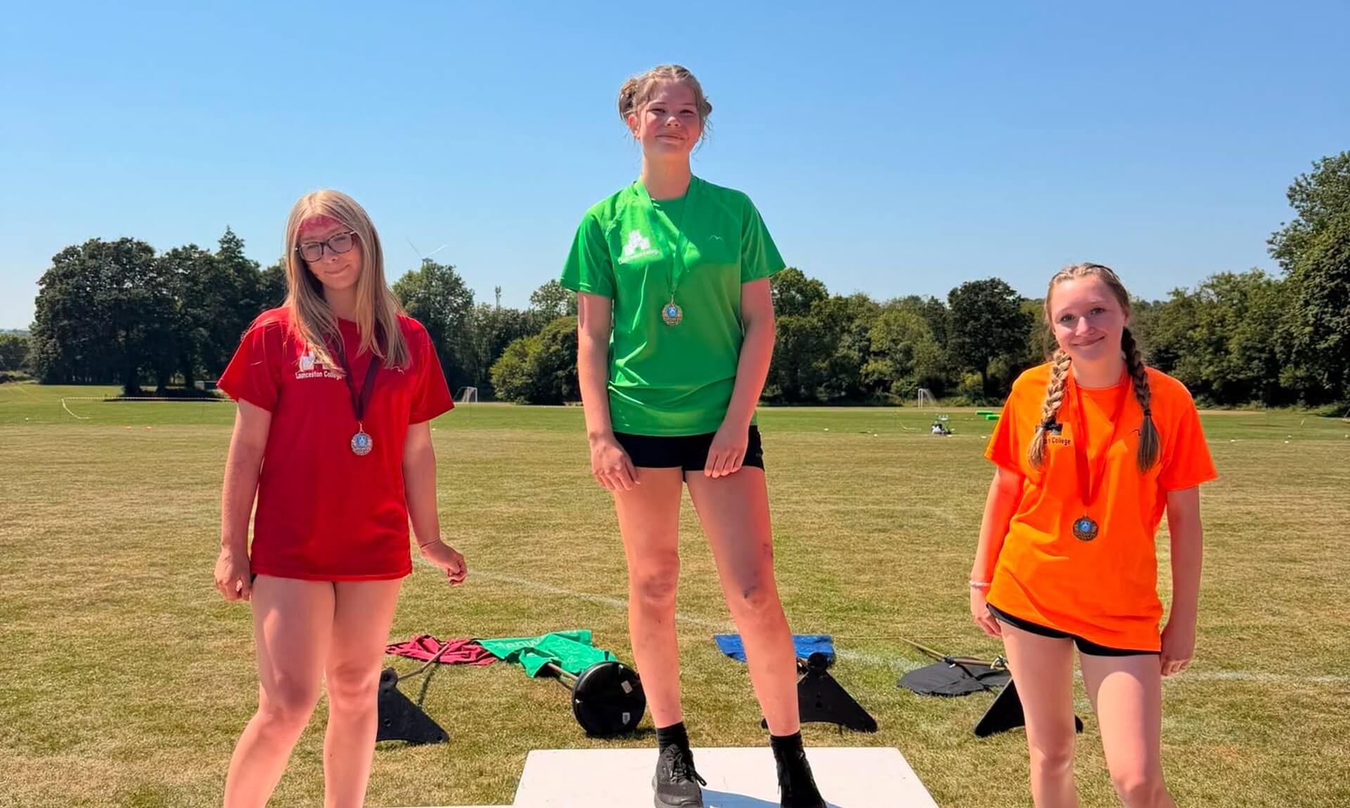 Winners celebrate on the podium at Launceston College sports day