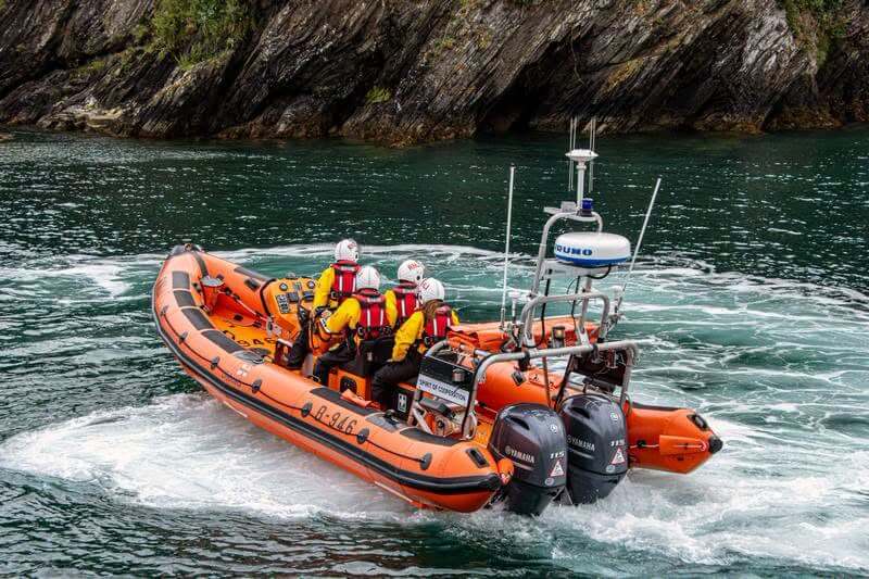 The RNLI relief Atlantic 85 lifeboat Spirit of Cooperation at speed off the Cornish coast