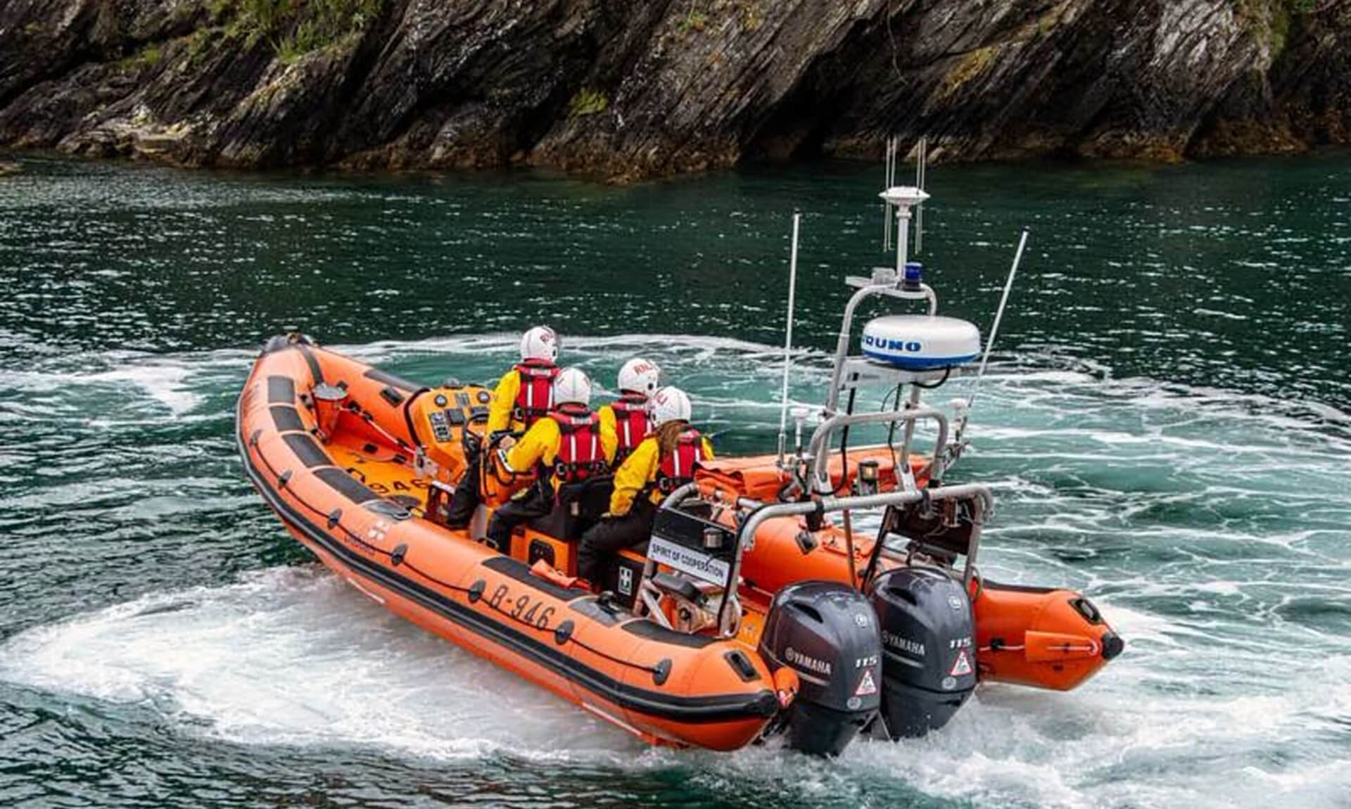The RNLI relief Atlantic 85 lifeboat Spirit of Cooperation at speed off the Cornish coast