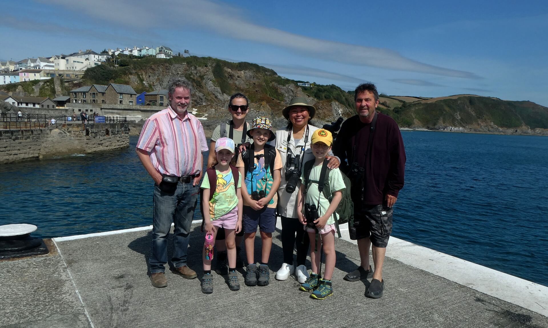 Birdwatching group on Mevagissey Harbour wall