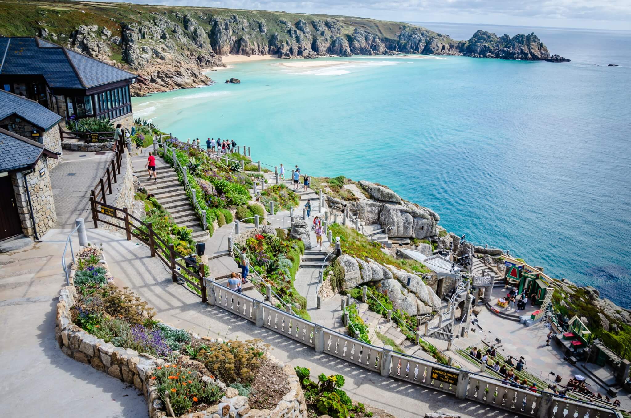 The Minack Theatre terraces above the turquoise sea at Porthcurno