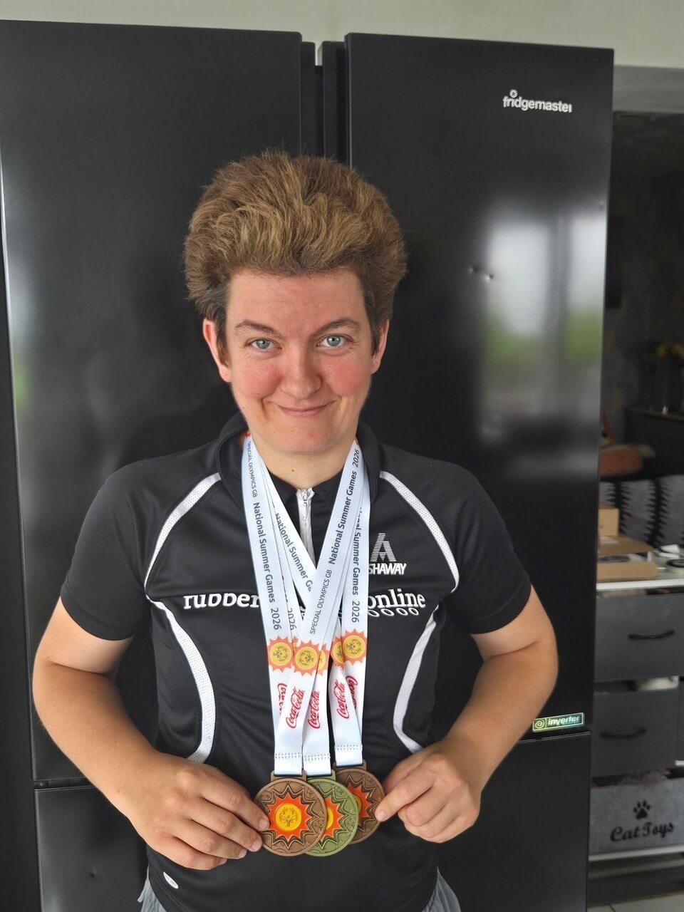 Nikki Welch wearing three medals from the Special Olympics GB National Summer Games 2026
