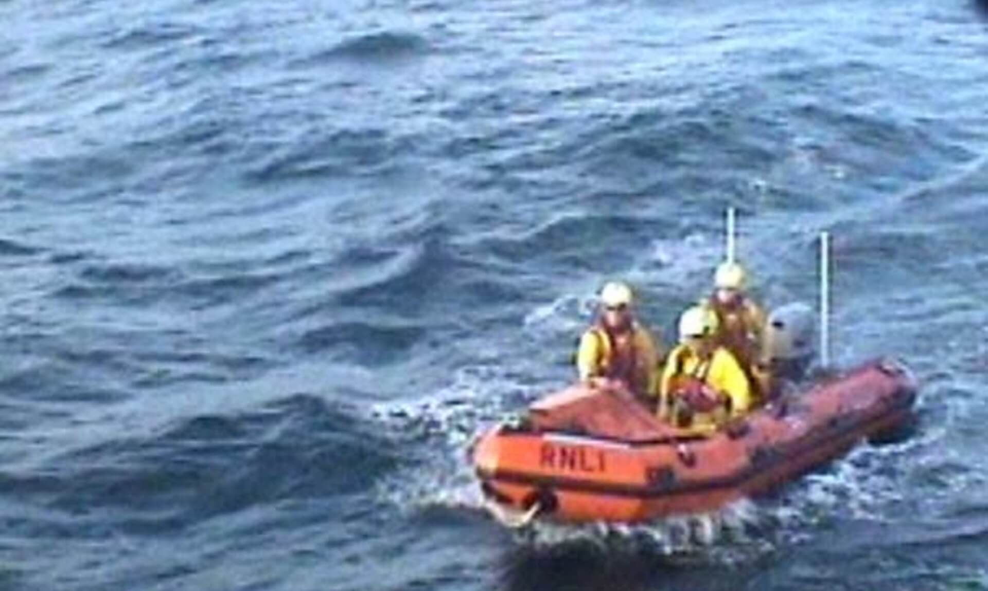 Padstow RNLI inshore lifeboat crew alongside Bude RNLI