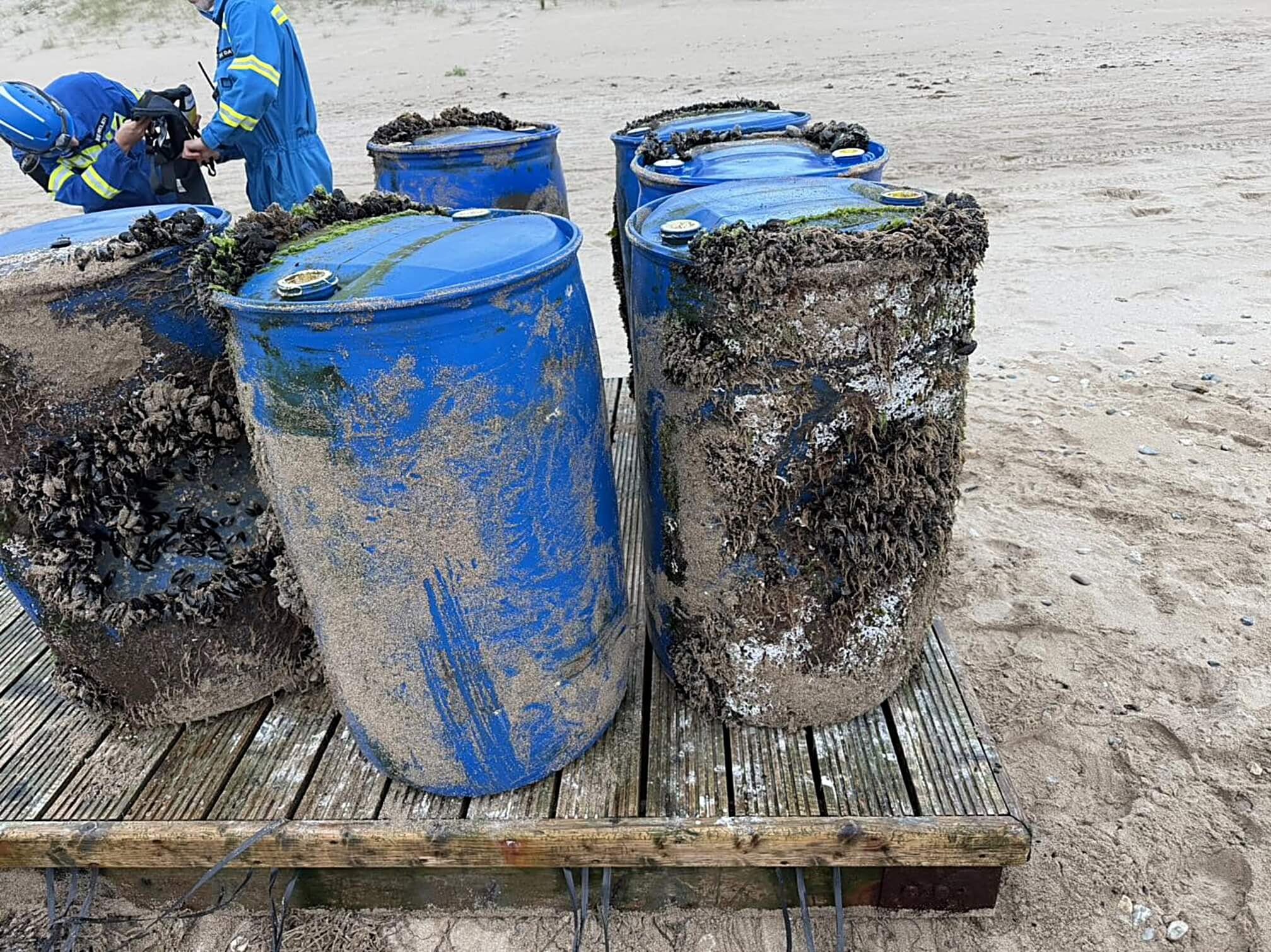 Barrels forming the underside of the recovered pontoon, encrusted with mussels and weed