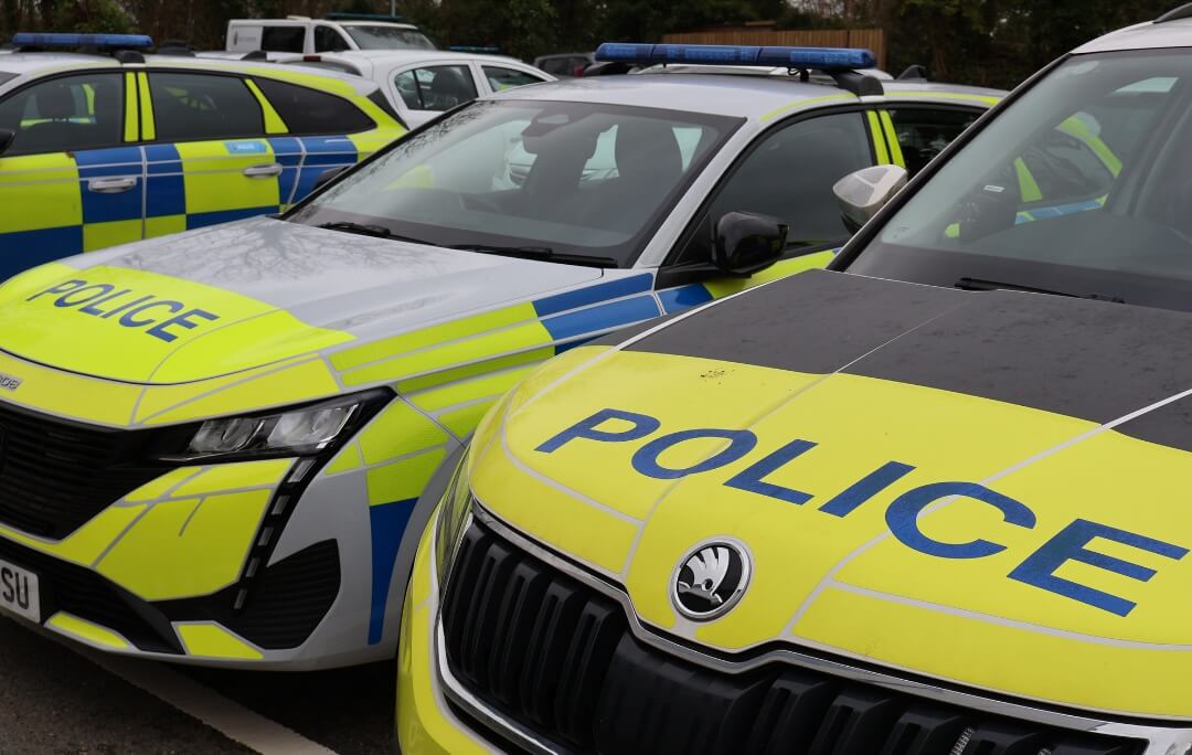 Devon and Cornwall Police cars parked in a line