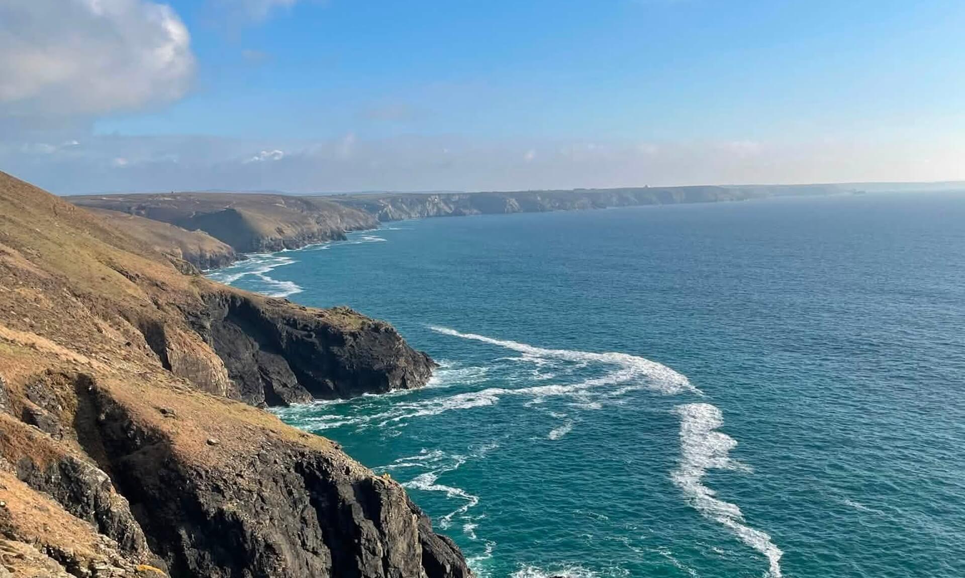 Cliffs and wind-streaked sea on the Cornwall coast near Portreath