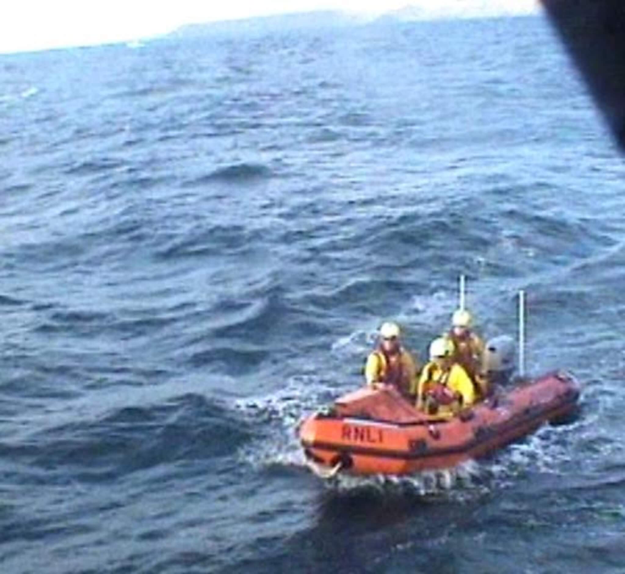 Padstow RNLI inshore lifeboat crew alongside Bude RNLI