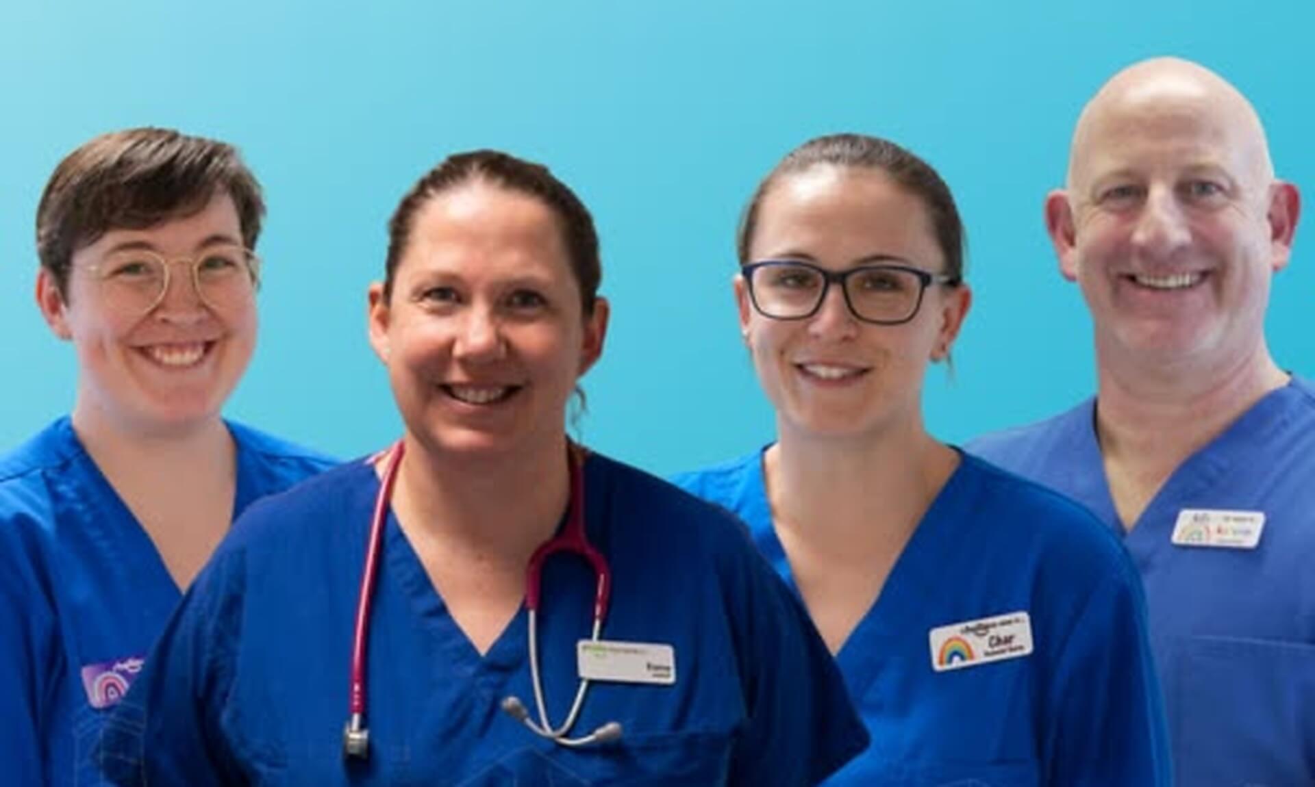 Four Royal Cornwall Hospitals Trust neonatal staff in blue scrubs smiling together