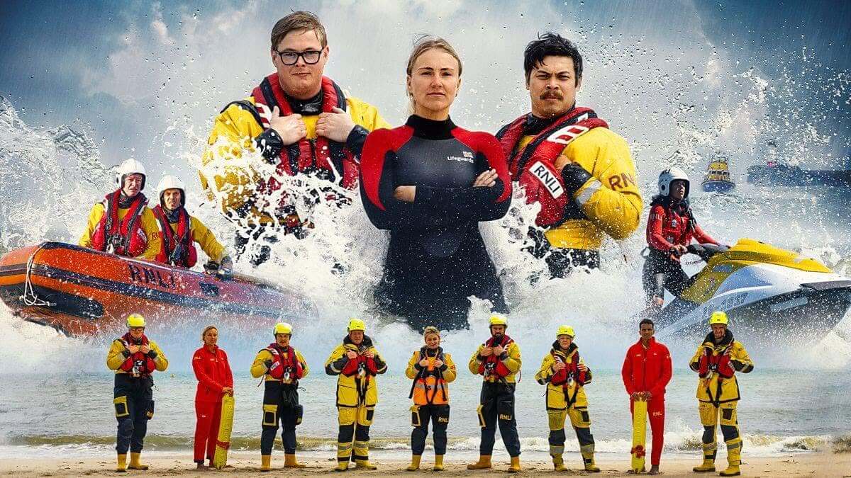 Cast of BBC series Saving Lives at Sea with RNLI lifeboat crew and lifeguards on a beach