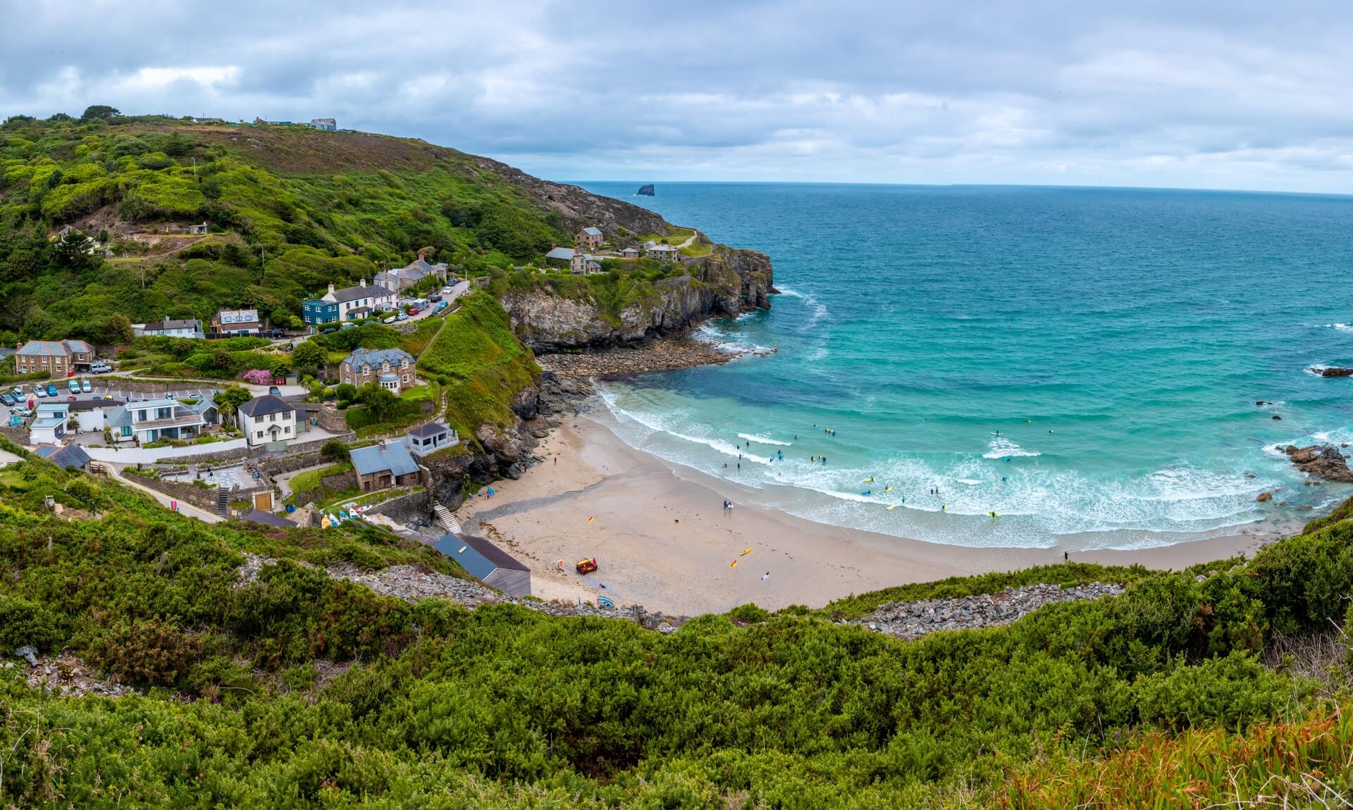 Trevaunance Cove at St Agnes, with the village, beach and headland seen from the cliff path