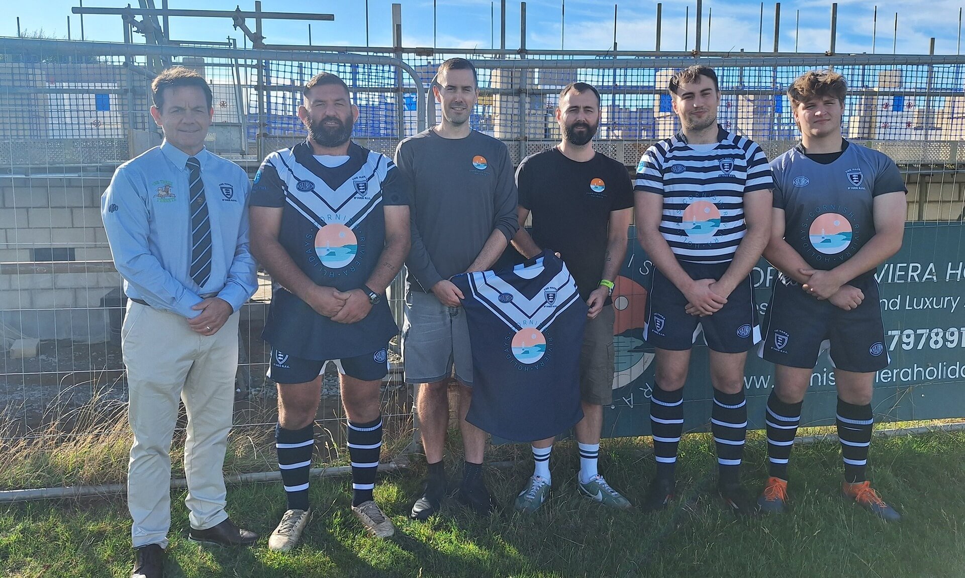 St Ives RFC players and Cornish Riviera Holidays directors in new kit