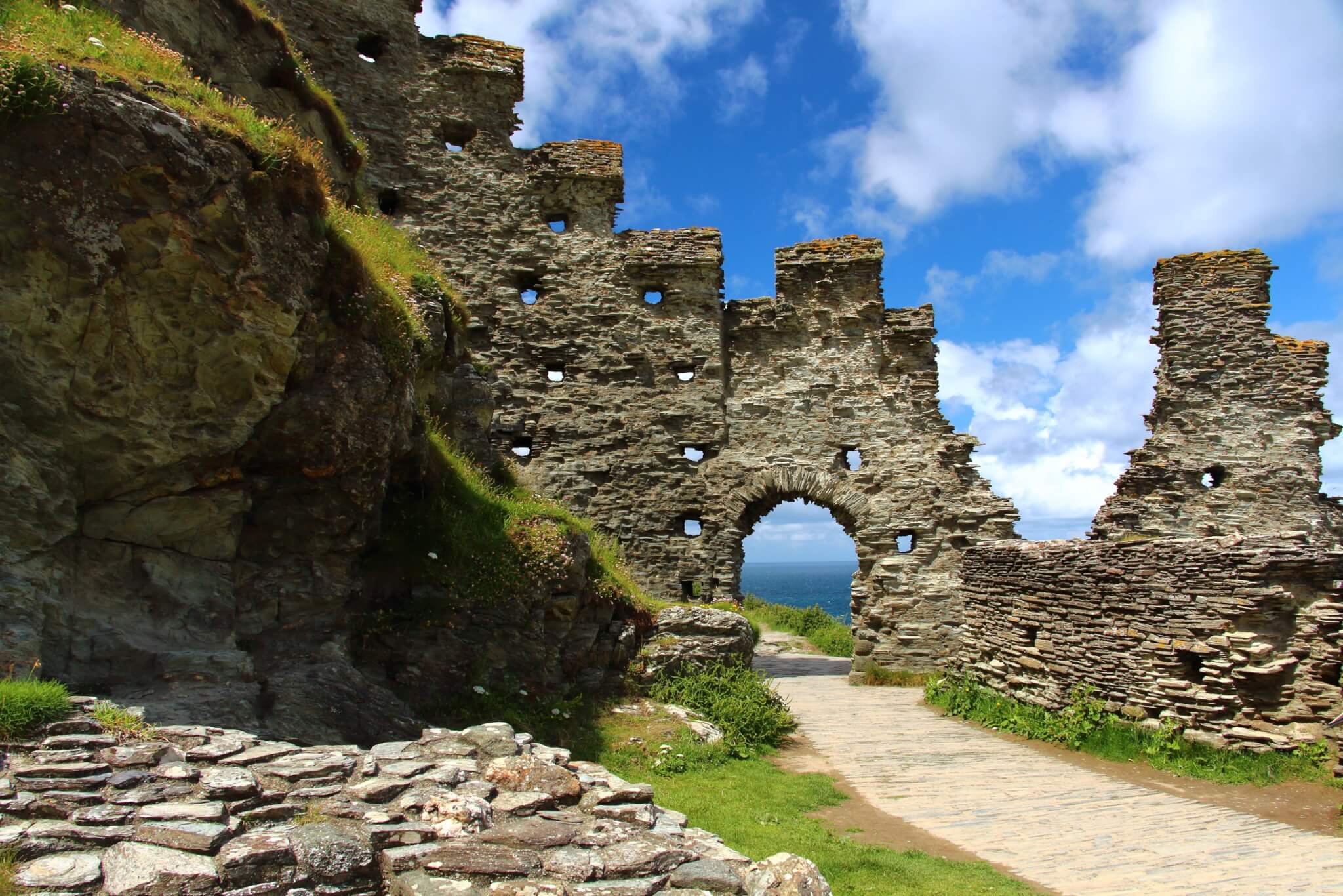 The ruins of Tintagel Castle above the sea on the north coast