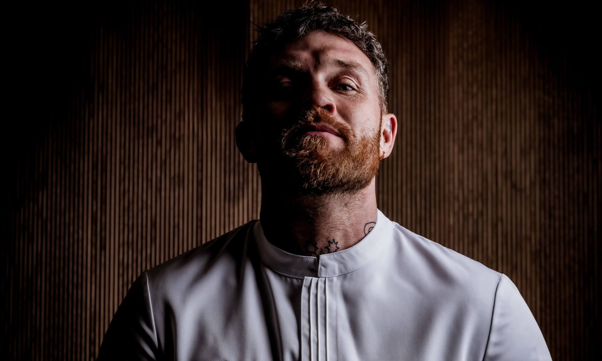 Chef Tom Brown in his Michelin-starred chef's jacket