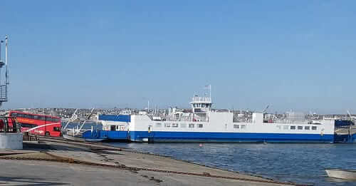 Torpoint Ferry docked at the slipway with a bus waiting to board