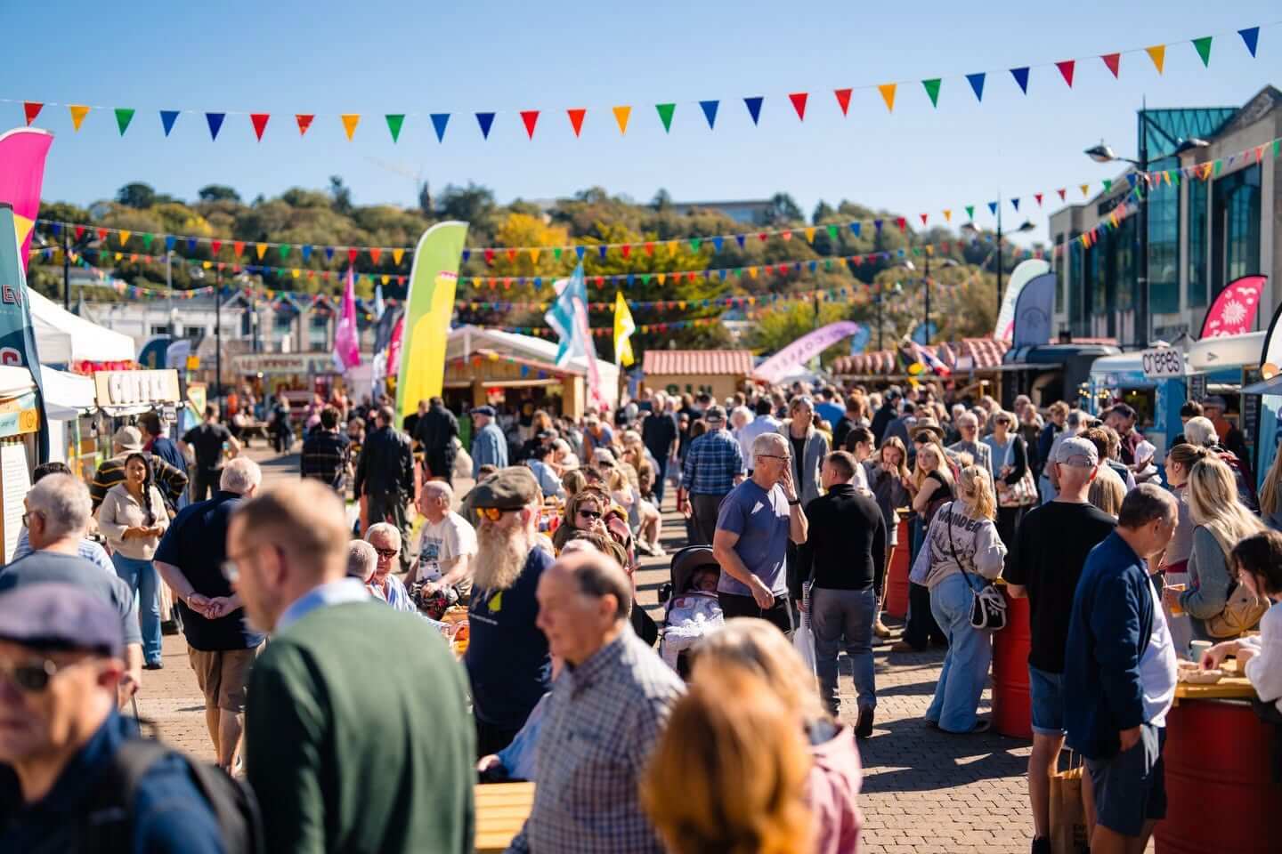 Crowds at the Truro Food Festival on Lemon Quay under colourful bunting