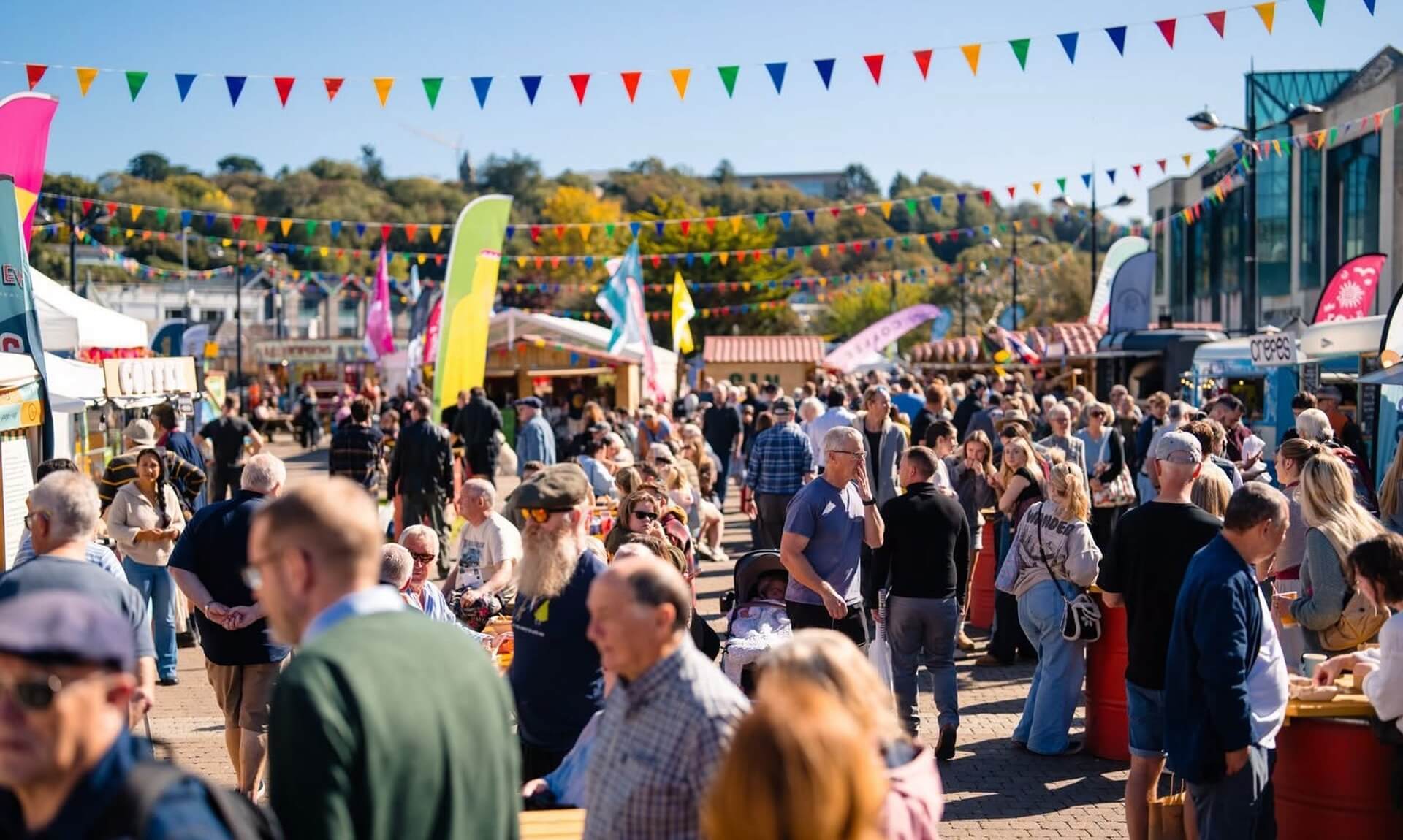 Crowds at the Truro Food Festival on Lemon Quay under colourful bunting