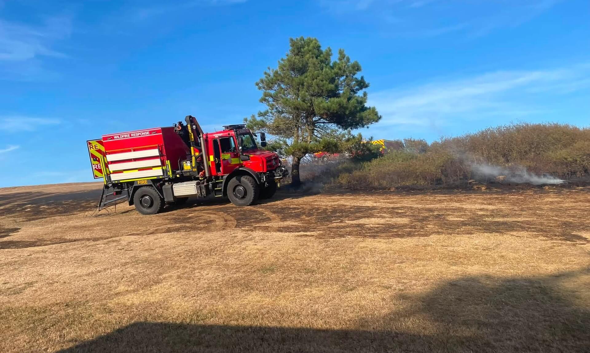 Cornwall Fire and Rescue wildfire response engine on burnt open ground
