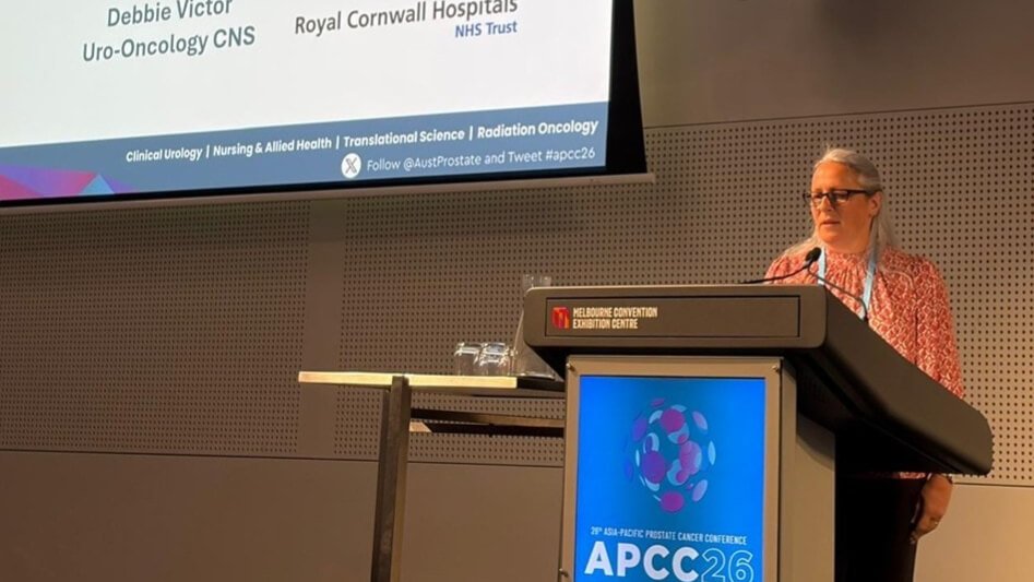 Debbie Victor at the podium at APCC26 in Melbourne