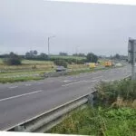 The A30 dual carriageway near Launceston with National Highways maintenance vehicles at the roadside