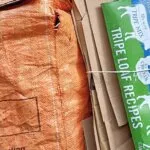 Flattened cardboard boxes bundled for recycling collection in Cornwall
