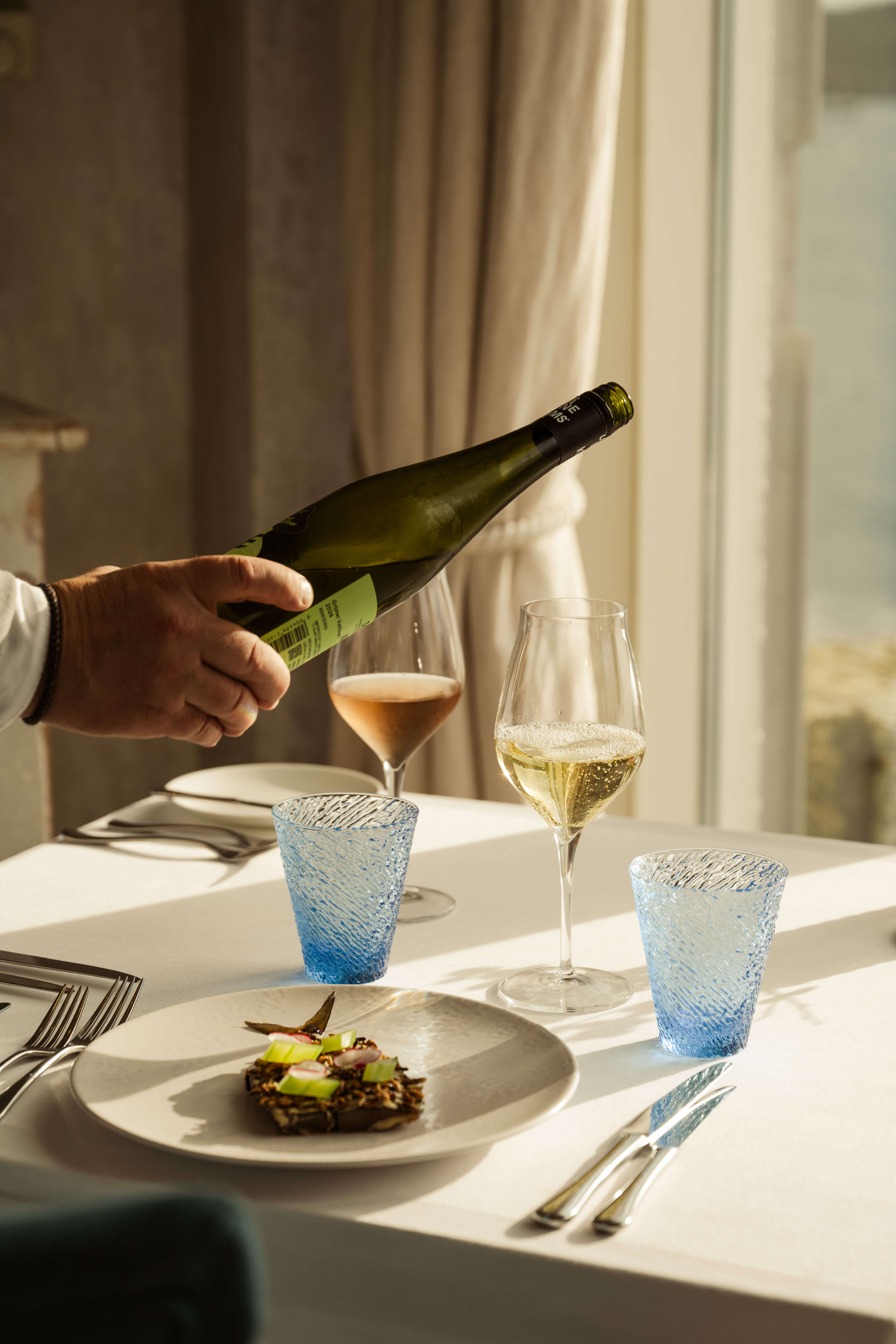 Wine being poured at Reef Knot Restaurant, The Idle Rocks