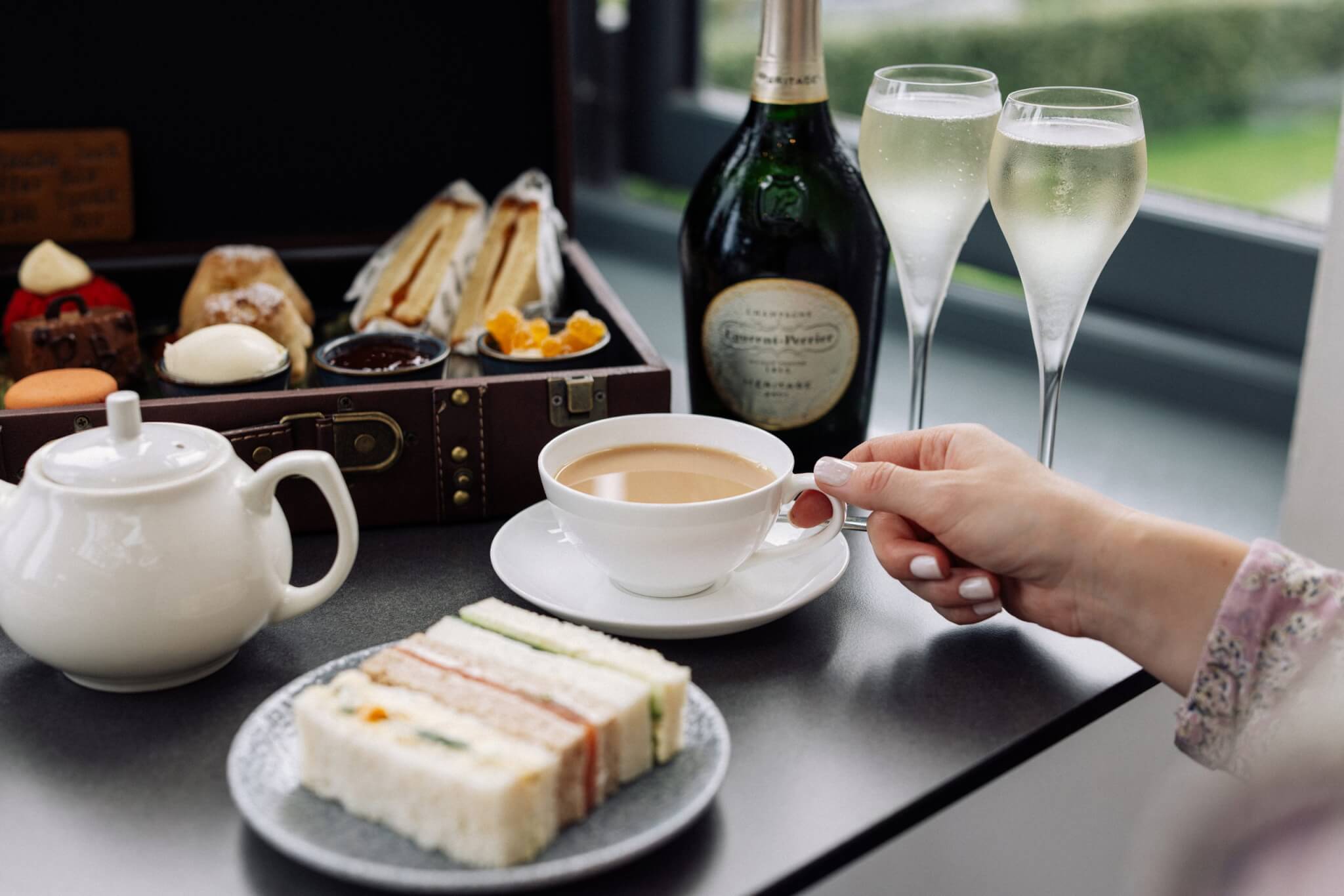 Afternoon tea with finger sandwiches, a teapot and Champagne at Carbis Bay