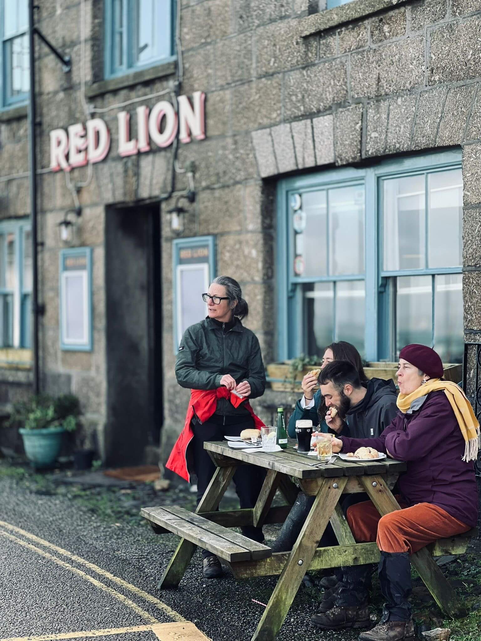 Customers at picnic benches outside the Red Lion in Newlyn
