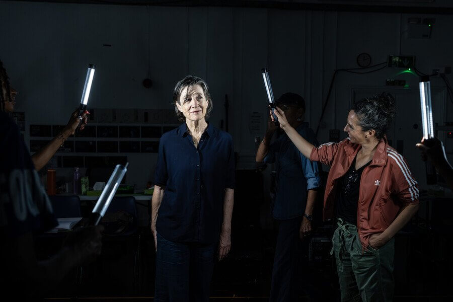 RSC Julius Caesar rehearsal with actors holding light tubes