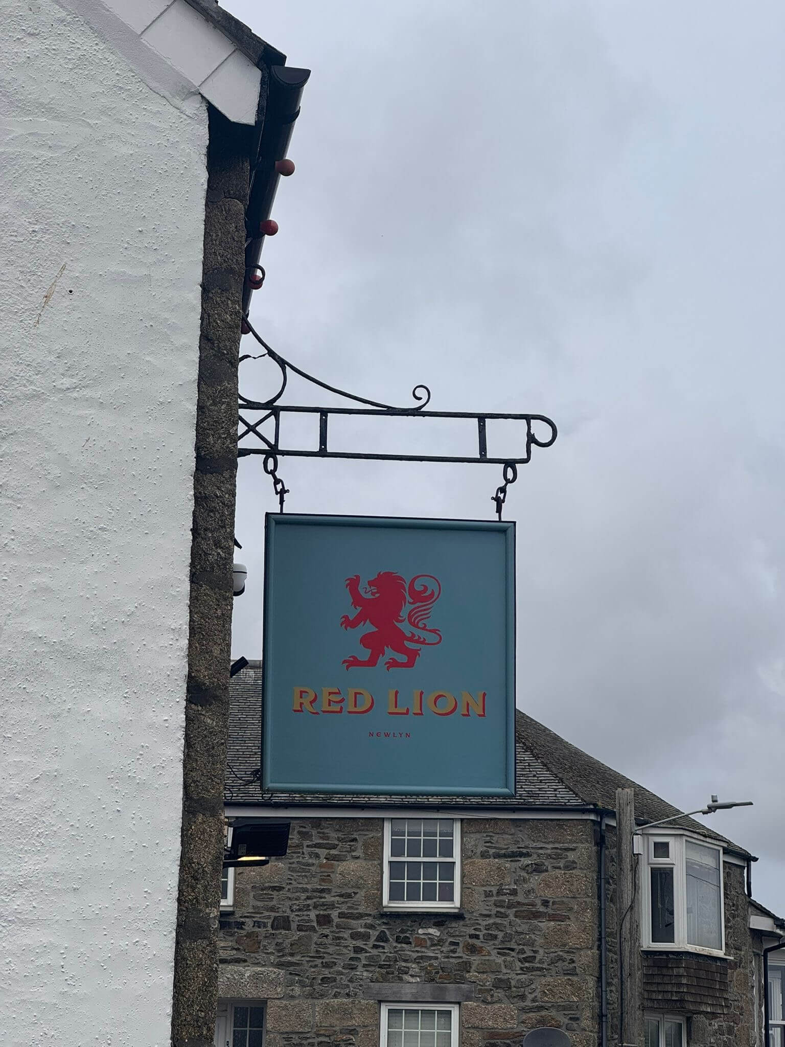 The hanging pub sign outside the Red Lion in Newlyn