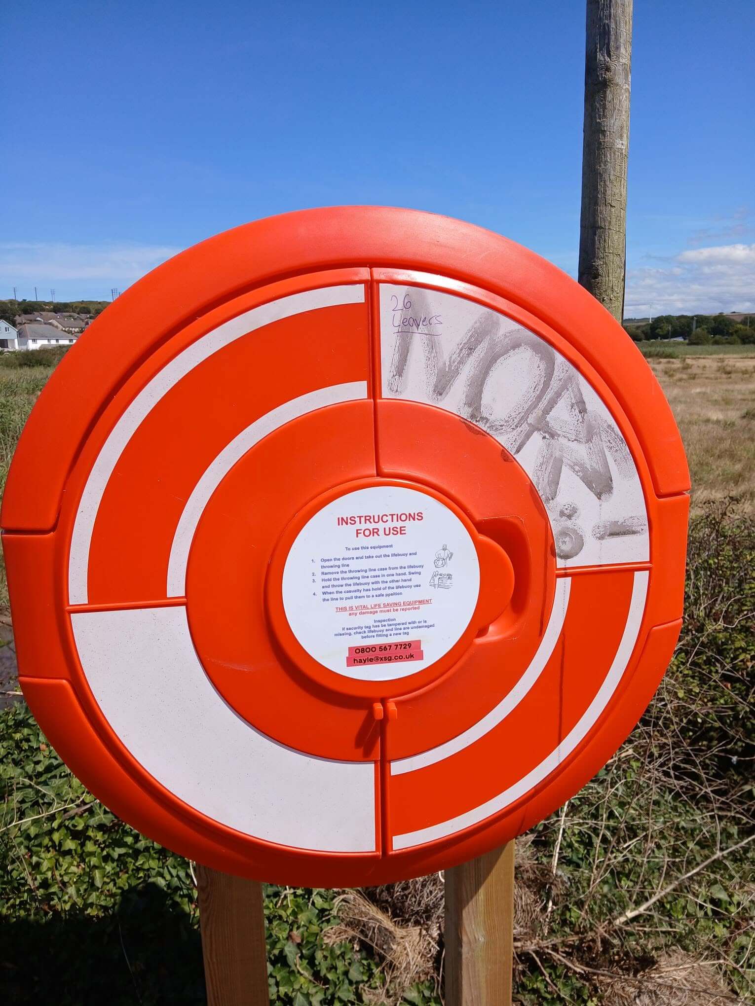 Vandalised lifebuoy station on Black Bridge, Hayle, with graffiti and no ring inside
