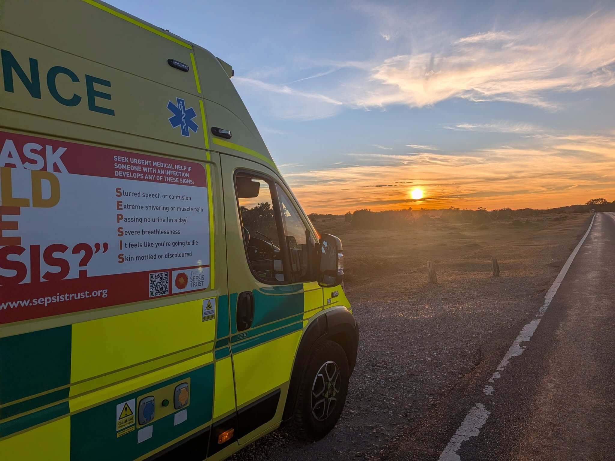South Western Ambulance Service vehicle at sunset