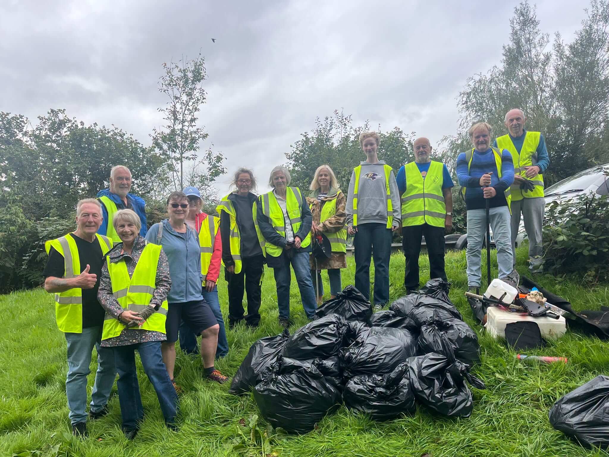 Bodmin Tidy it Team volunteers with bags of collected litter