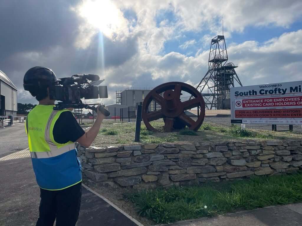 Camera operator filming at the South Crofty entrance