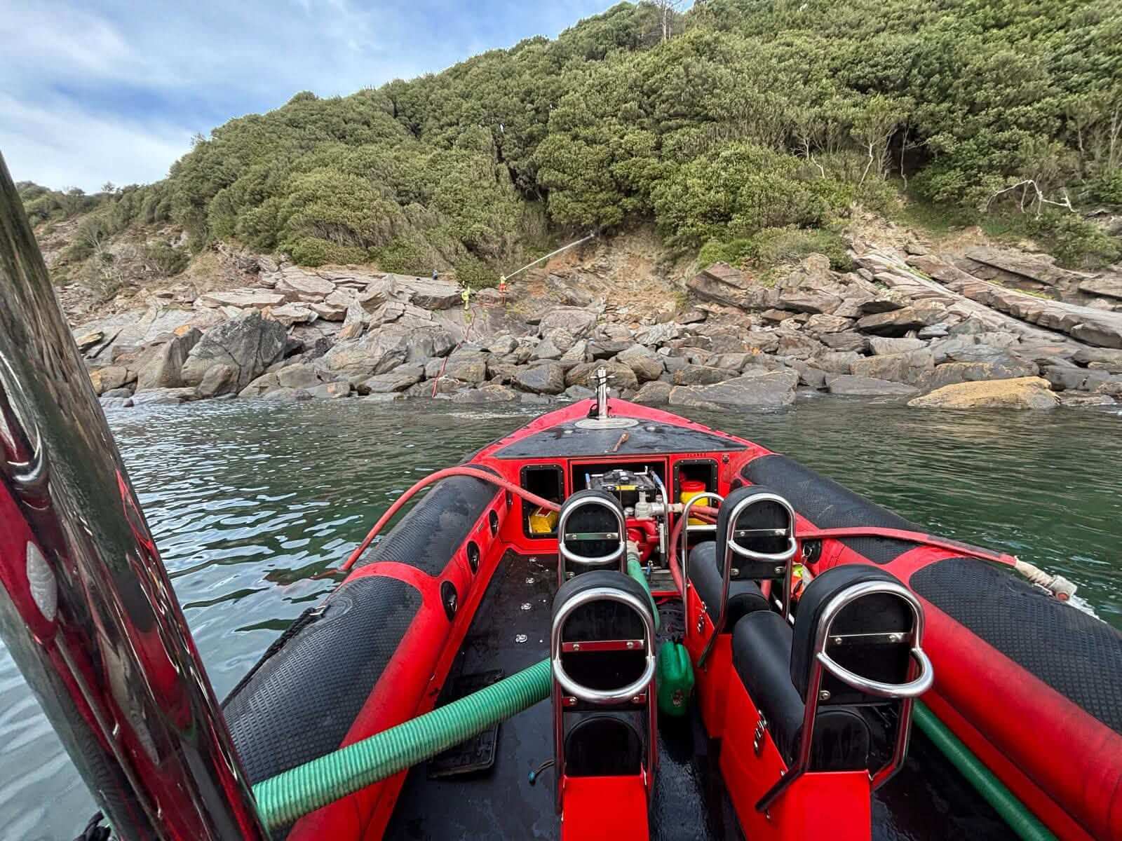 View from the Falmouth fire boat towards crews on the shore between Grebe and Mawnan