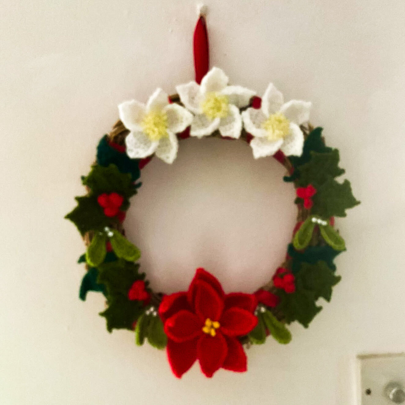 A hand crocheted Christmas wreath, the Liskeard Yarn Swap raffle prize
