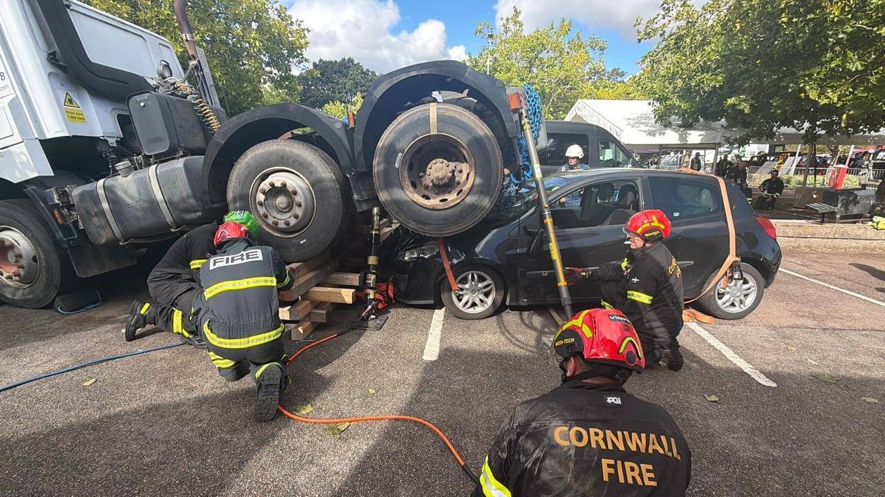 Cornwall firefighters help lift a lorry off a car during the Heavy Rescue Challenge