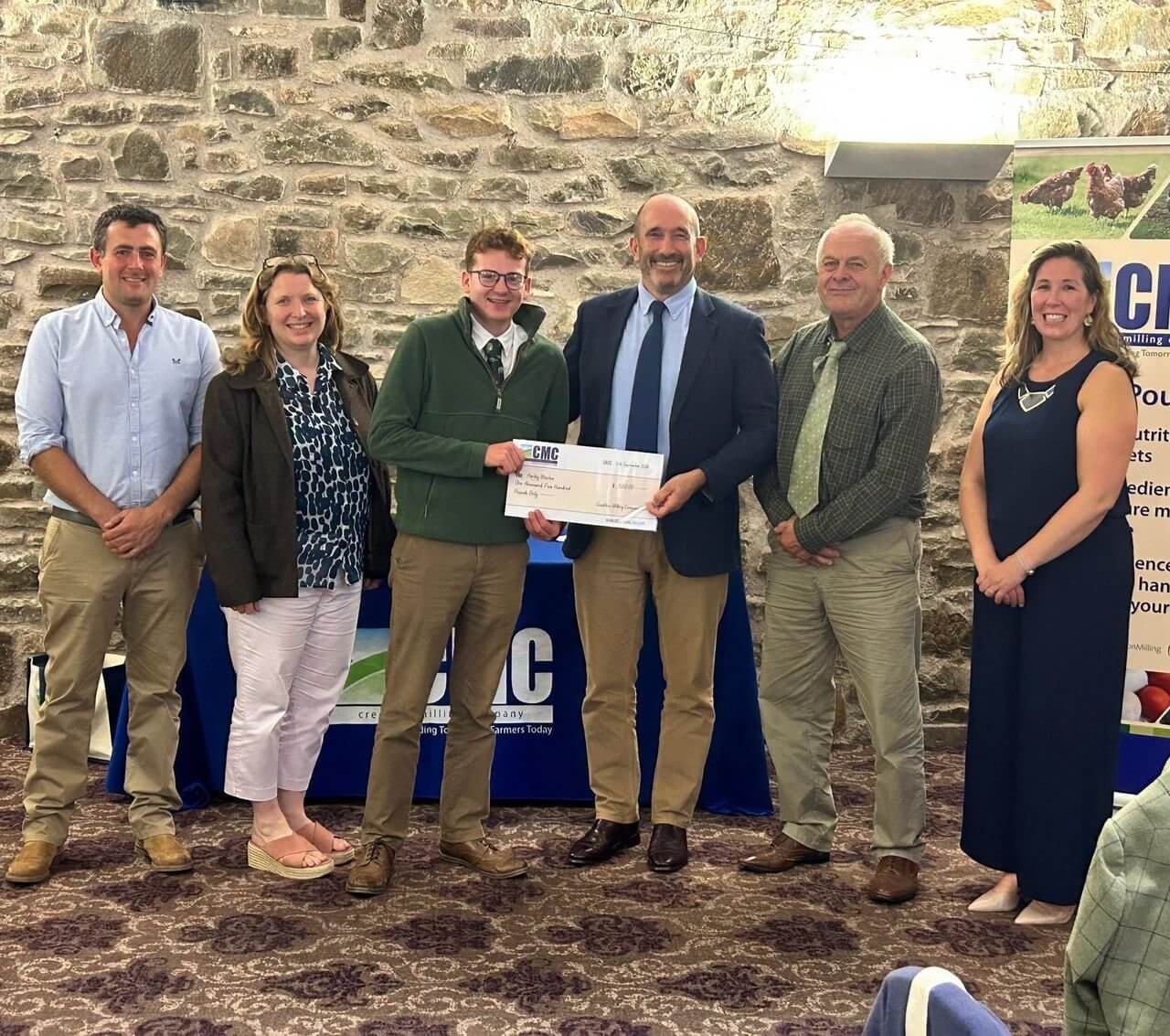 Harley Weston holding a Crediton Milling cheque at the Farm Business Apprentice 2026 Award ceremony