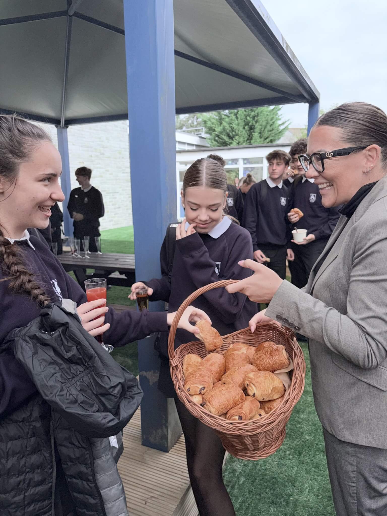 Head of School Linda Blackburn offers pastries to students at the opening of The Pavilion at Launceston College