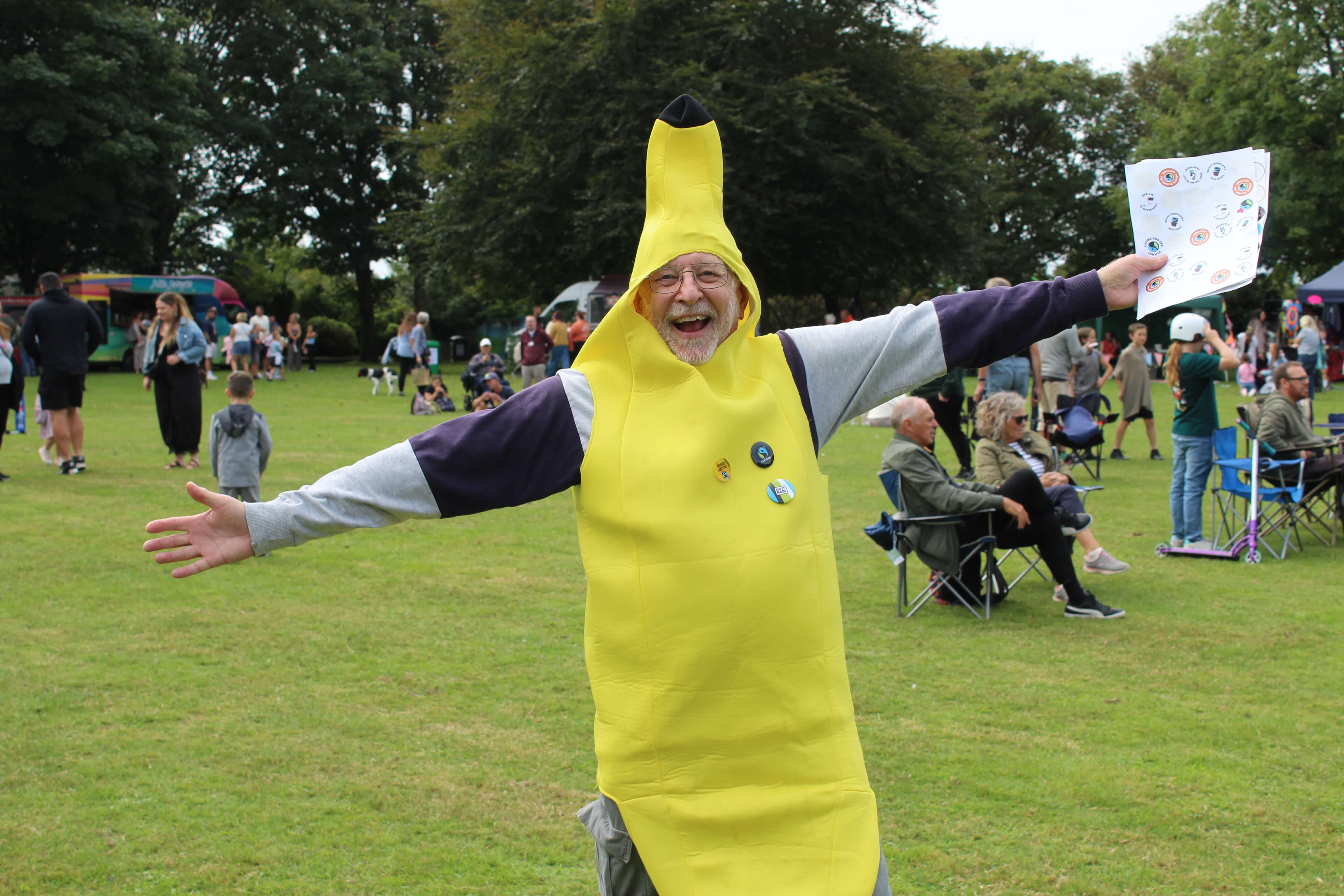 Man in a giant banana costume with arms outstretched at Camborne Green Fest
