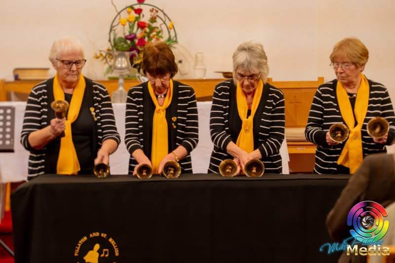 Handbell ringers performing at the Saltash Music, Speech and Drama Festival