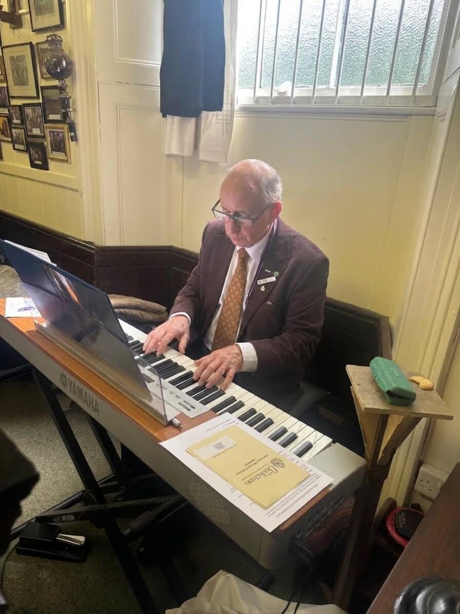 Ian, the district organist, playing at the Oddfellows half-yearly meeting