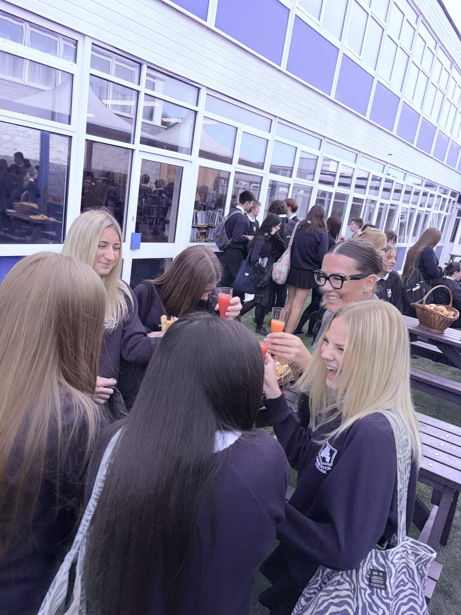 Students celebrate with drinks and pastries outside at Launceston College