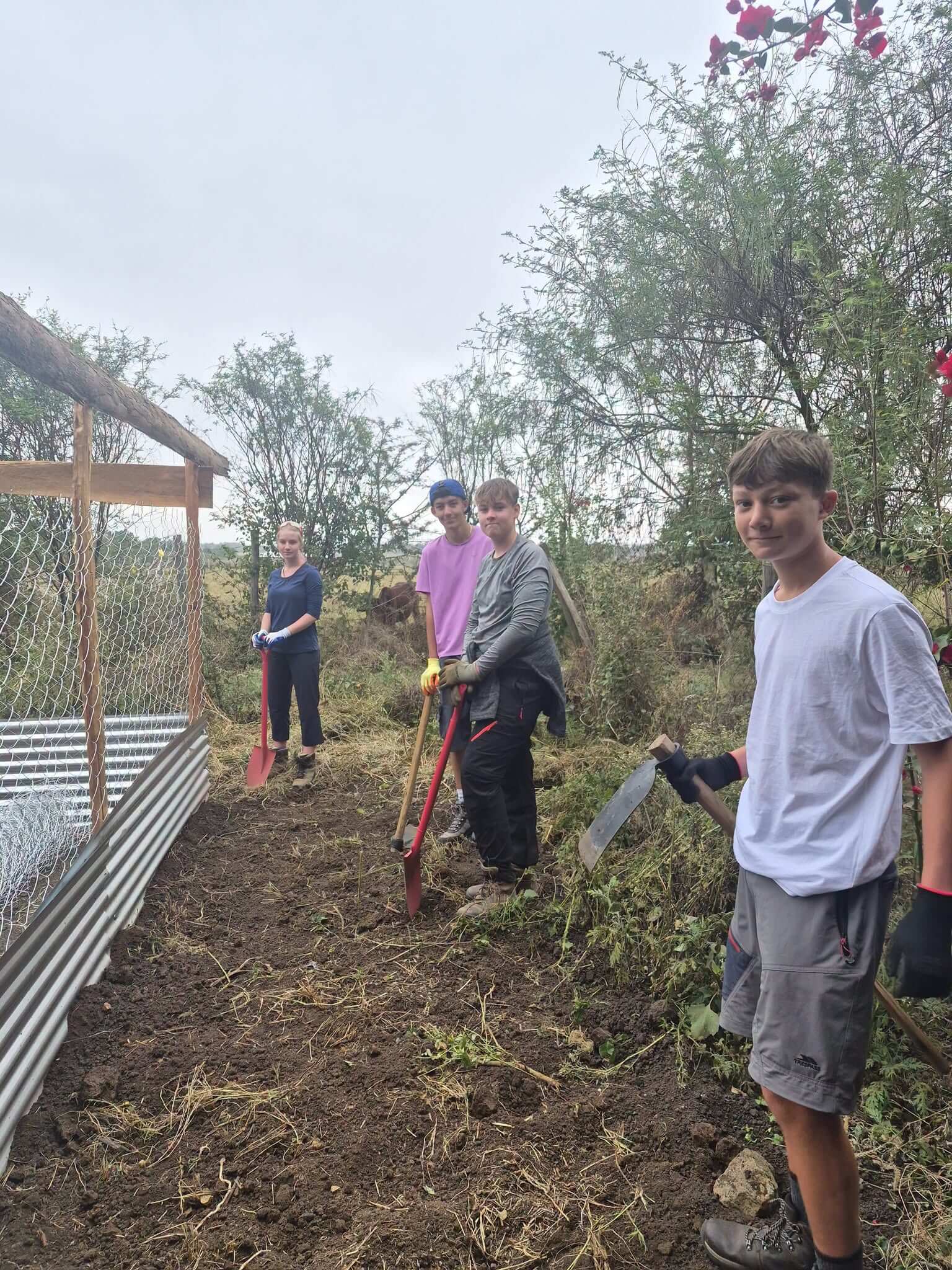 Students help to build a predator-proof boma to protect livestock