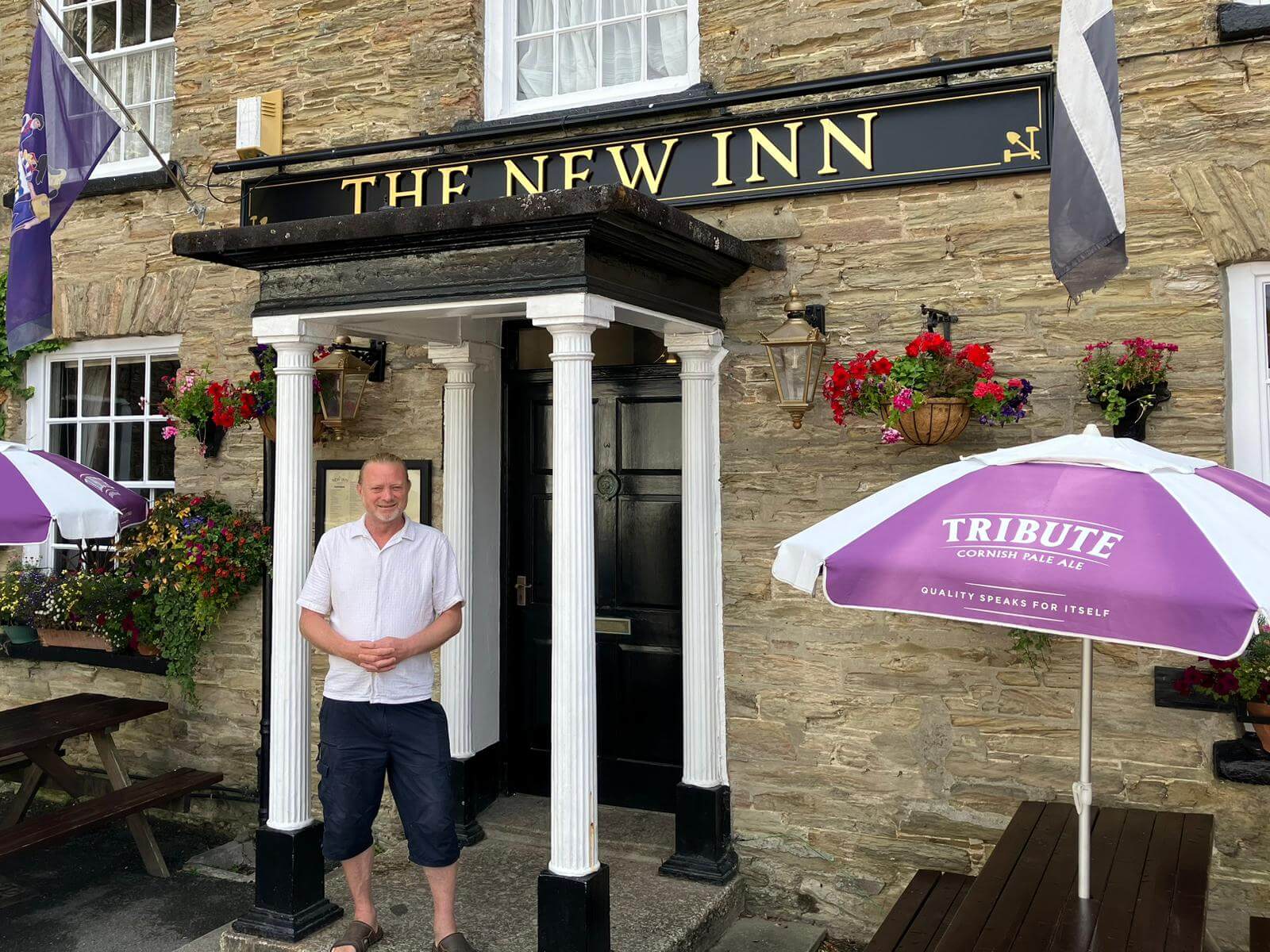 The New Inn pub sign and entrance in Tywardreath